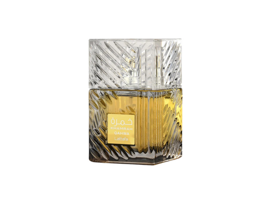 Decorative glass perfume bottle with gold label on a white background