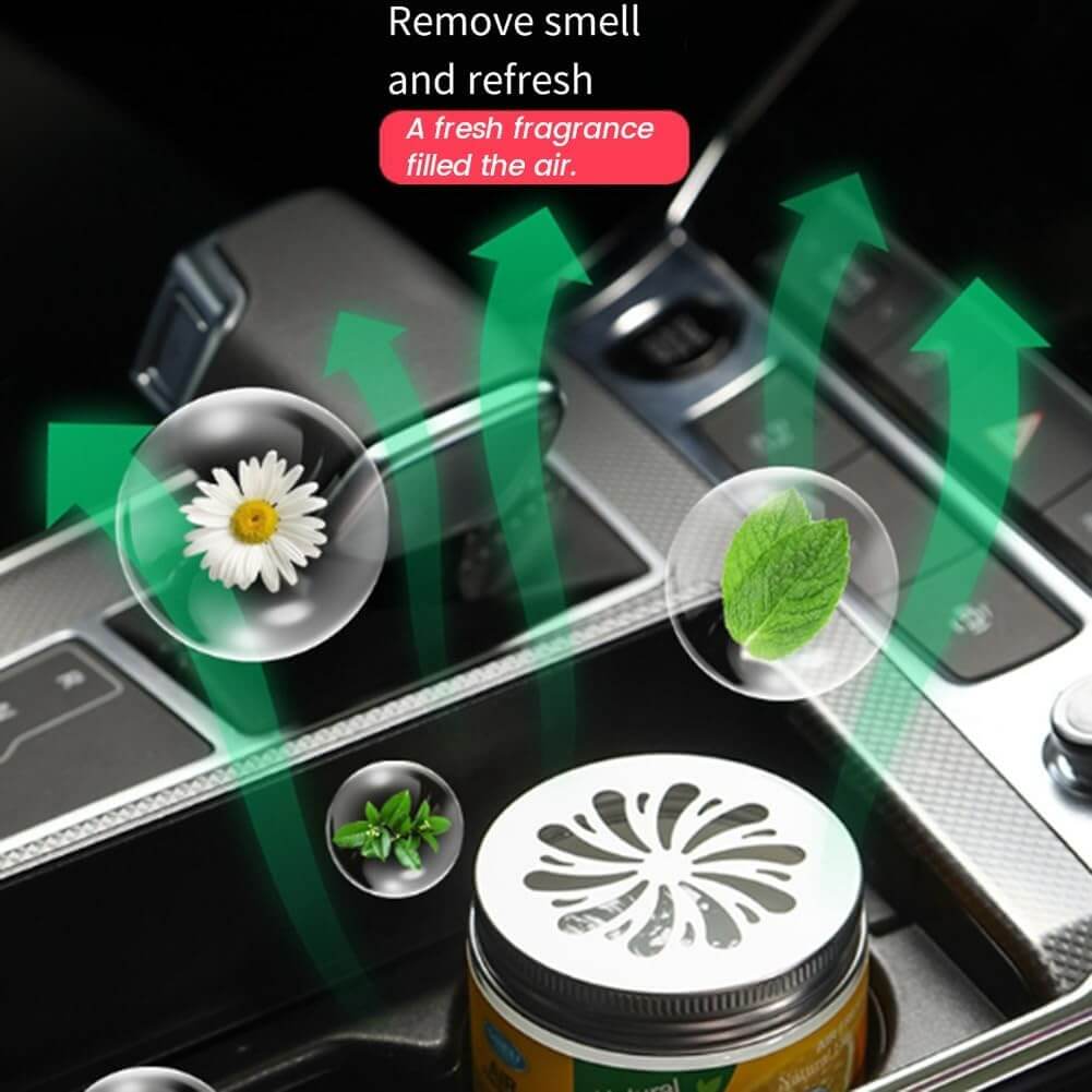 Jello car air freshener with floral and mint elements on a car dashboard.