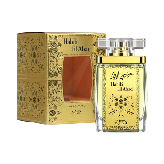 Habibi Lil Abad Eau de Parfum bottle with a gold label and clear cap, shown next to its ornate gold-patterned box on a white background.