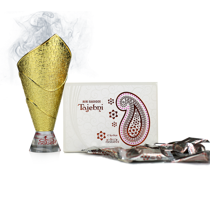 Bakhoor burner with a box labeled 'Tajebni' on a white background