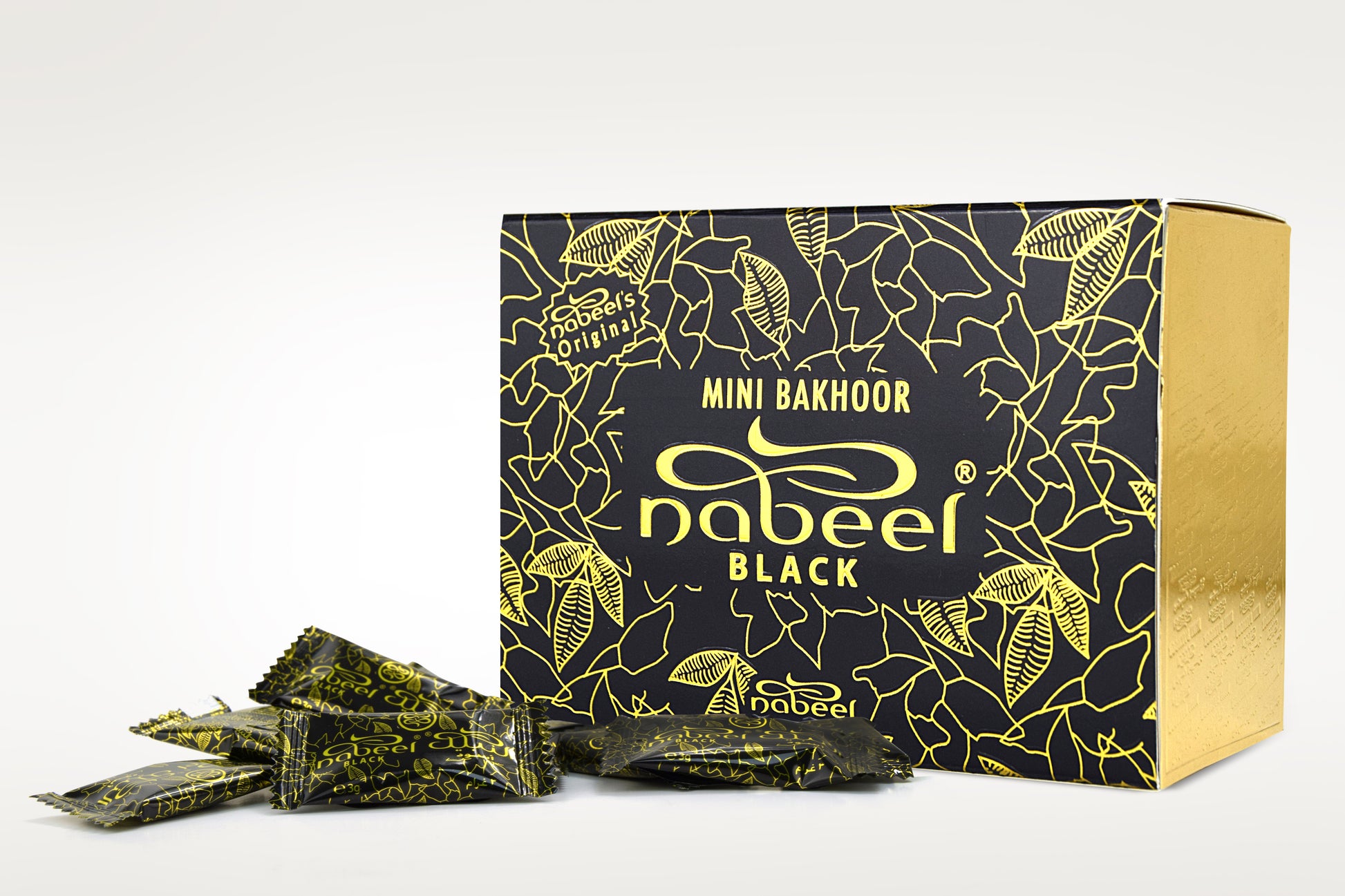 Nabeel Black mini bakhoor packaging with gold accents on a white background