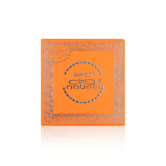Orange box with silver decorative elements and 'Bakhoor Nabeel' branding on a white background