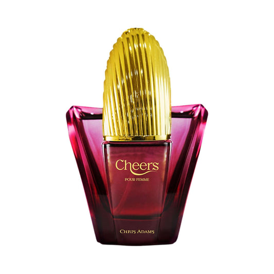 Cheers Eau de Parfum fragrance bottle by Chris Adams, featuring a faceted deep red glass base and a ribbed metallic gold cap, set against a plain white background.
