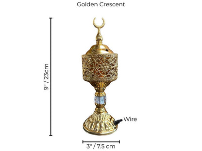 Decorative golden bakhoor burner with crescent symbol and measurements on a white background
