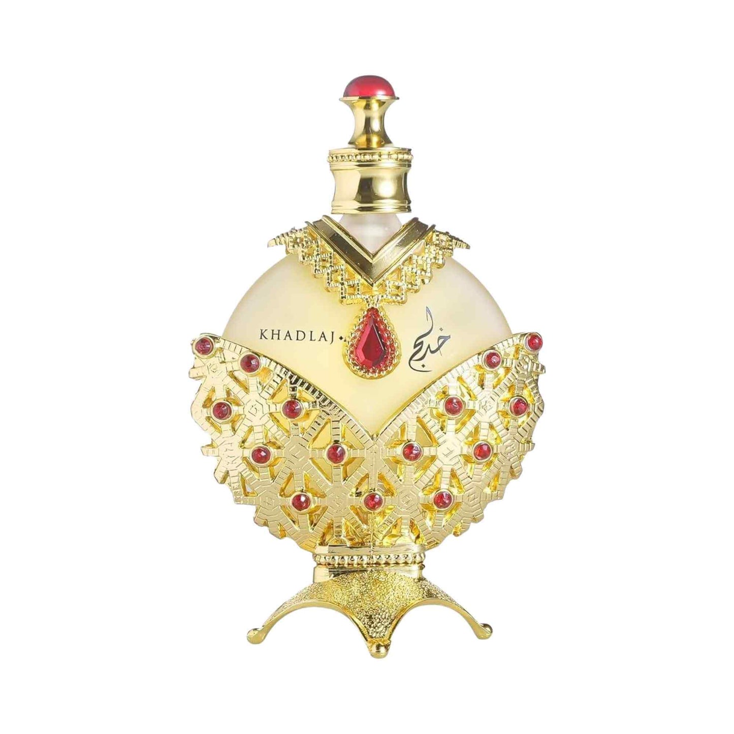 An ornate perfume bottle with a cream-colored body, heavily decorated with gold filigree and accented with red gemstones, on a plain white background.