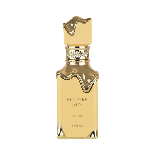 Gold Lattafa perfume bottle with 'Eclaire' branding on a white background.