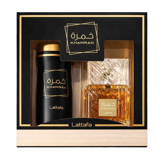 Lattafa Khamrah fragrance gift set in a black and gold box, containing a tall black cylindrical bottle with a gold cap and a faceted clear glass perfume bottle filled with amber liquid.