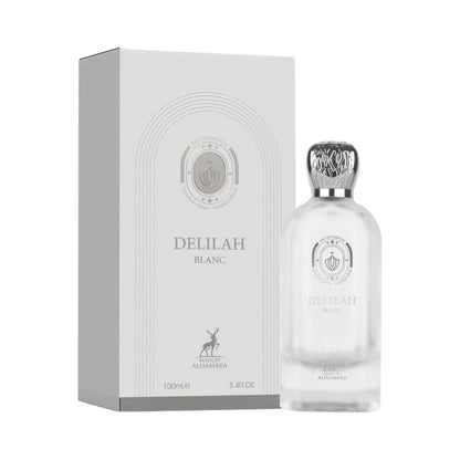 Delilah Blanc perfume bottle with a silver cap next to its white packaging box, featuring the brand name and a deer logo.