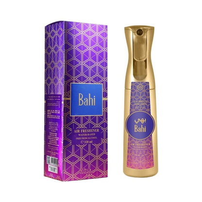 On the left, a box with Nabeel and Bahi branding. On the right, a gold air freshener bottle with purple and pink sticker that has Nabeel and Bahi branding on a white background.