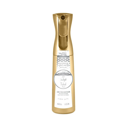 Gold air freshener bottle with white sticker that has Nabeel and Fulad Azm branding on a white background.