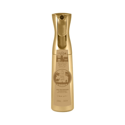 A bottle of Irth Gold water based air freshener featuring a gold design with desert-themed illustrations, shown on a plain white background.