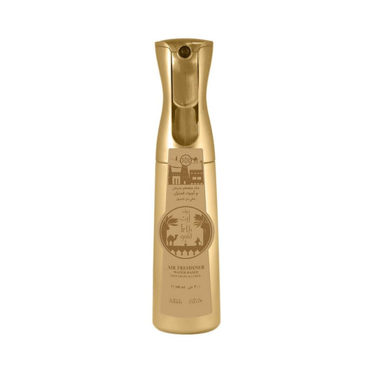 A bottle of Irth Gold water based air freshener featuring a gold design with desert-themed illustrations, shown on a plain white background.