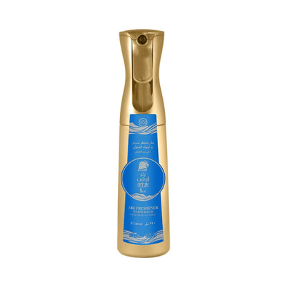 Gold air freshener bottle with blue sticker that has Nabeel and Ocean Blue branding on a white background.